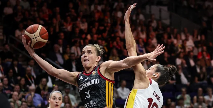 Women's basketball players celebrating